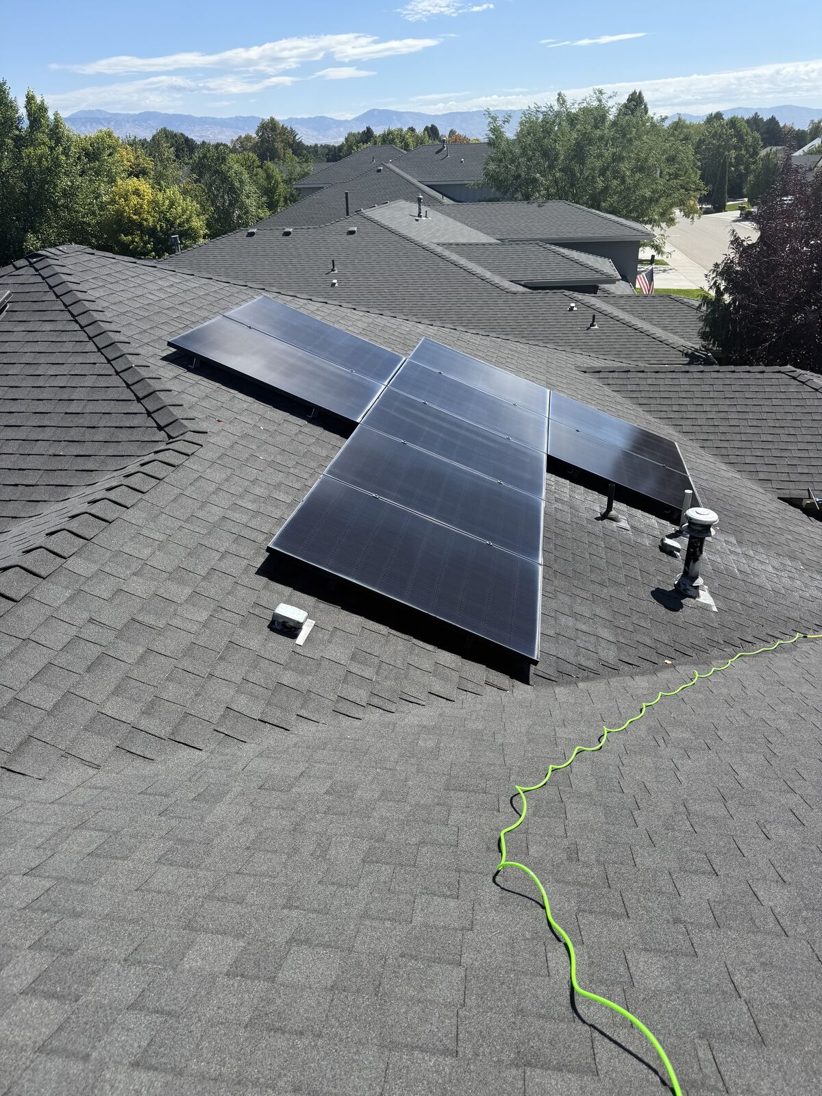 Asche Brothers cleaning rooftop solar panels in the Treasure Valley